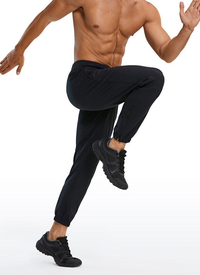 CRZ YOGA Men's Run Slim Fit On the Travel Joggers 28''- Ankle Zipper Black