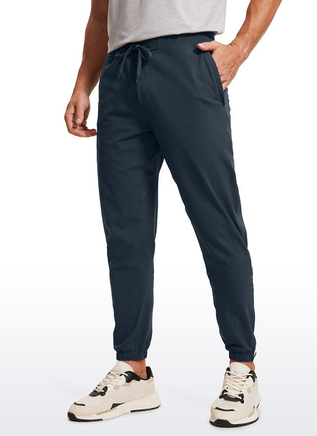 CRZ YOGA Men's Run Slim Fit On the Travel Joggers 32''- Ankle Zipper Melanite