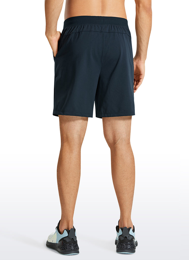 CRZ YOGA Men's Train Relaxed Fit On the Travel Linerless Shorts 7'' True Navy