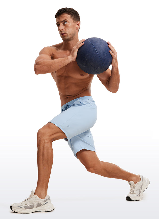 CRZ YOGA Men's Train Relaxed Fit On the Travel Linerless Shorts 7'' Chambray Blue