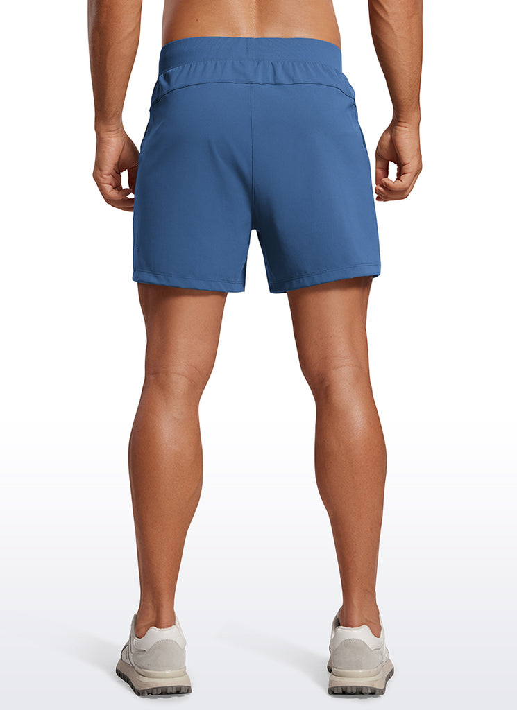 CRZ YOGA Men's Train Relaxed Fit On the Travel Linerless Shorts 5'' Pitch Blue