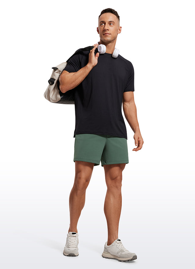 CRZ YOGA Men's Train Relaxed Fit On the Travel Linerless Shorts 5'' Dark Forest Green