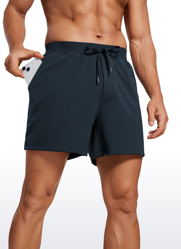 CRZ YOGA Men's Train Relaxed Fit On the Travel Linerless Shorts 5'' True Navy
