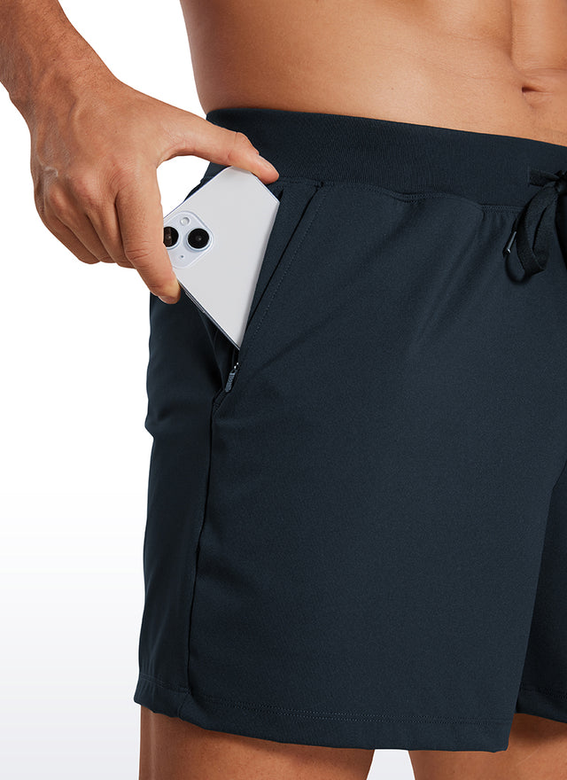 CRZ YOGA Men's Train Relaxed Fit On the Travel Linerless Shorts 5'' True Navy