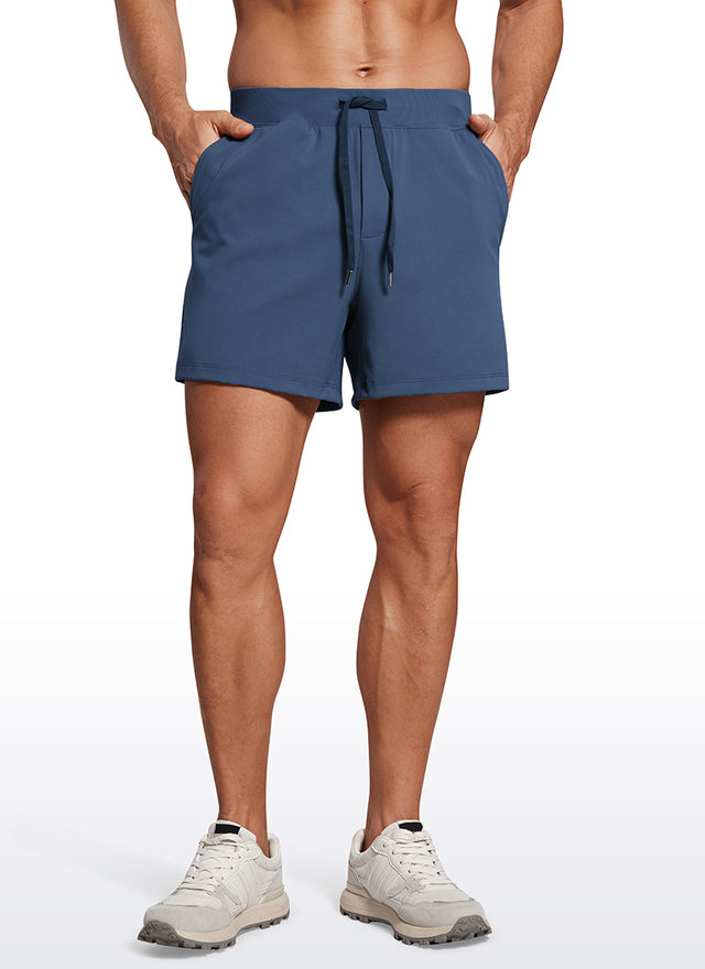 CRZ YOGA Men's Train Relaxed Fit On the Travel Linerless Shorts 5'' Electric Blue