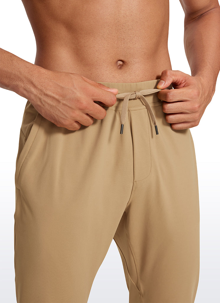 CRZ YOGA Men's Train Relaxed Fit On the Travel Pants 30'' Khaki Sand