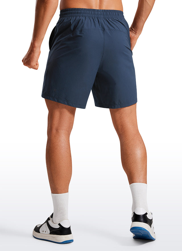 CRZ YOGA Men's Training Quick Dry Pocketed Linerless Shorts 7'' Stelindigo