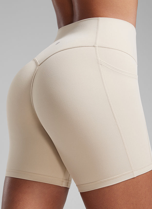 CRZ YOGA Butterlift Womens Scrunch Butt No Front Seam Pocket Biker Shorts 5'' Mojave Tan