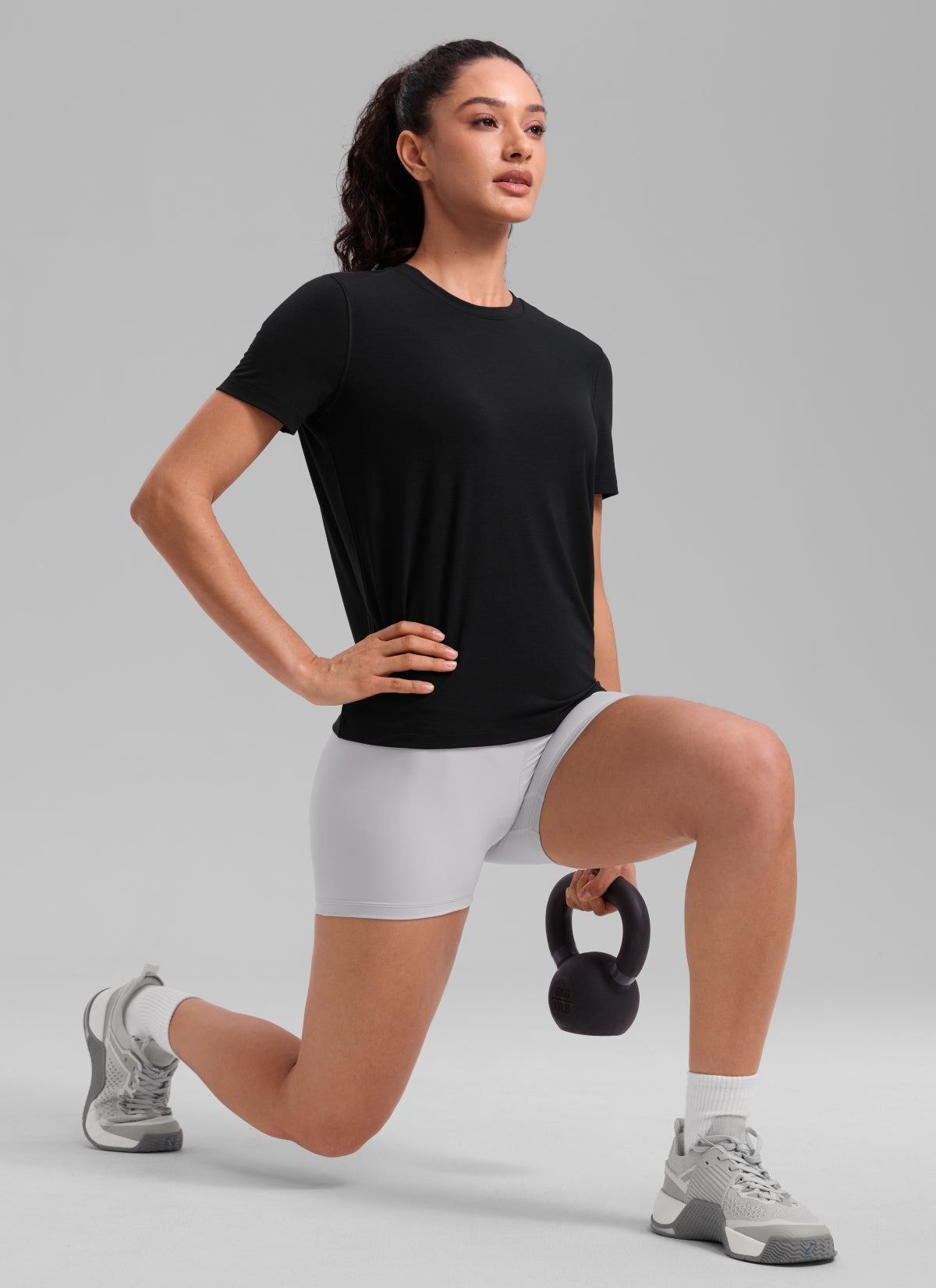 CRZ YOGA Women's Quick Dry Workout Crewneck Hip Length Short Sleeve Black @model_info:Larissa
