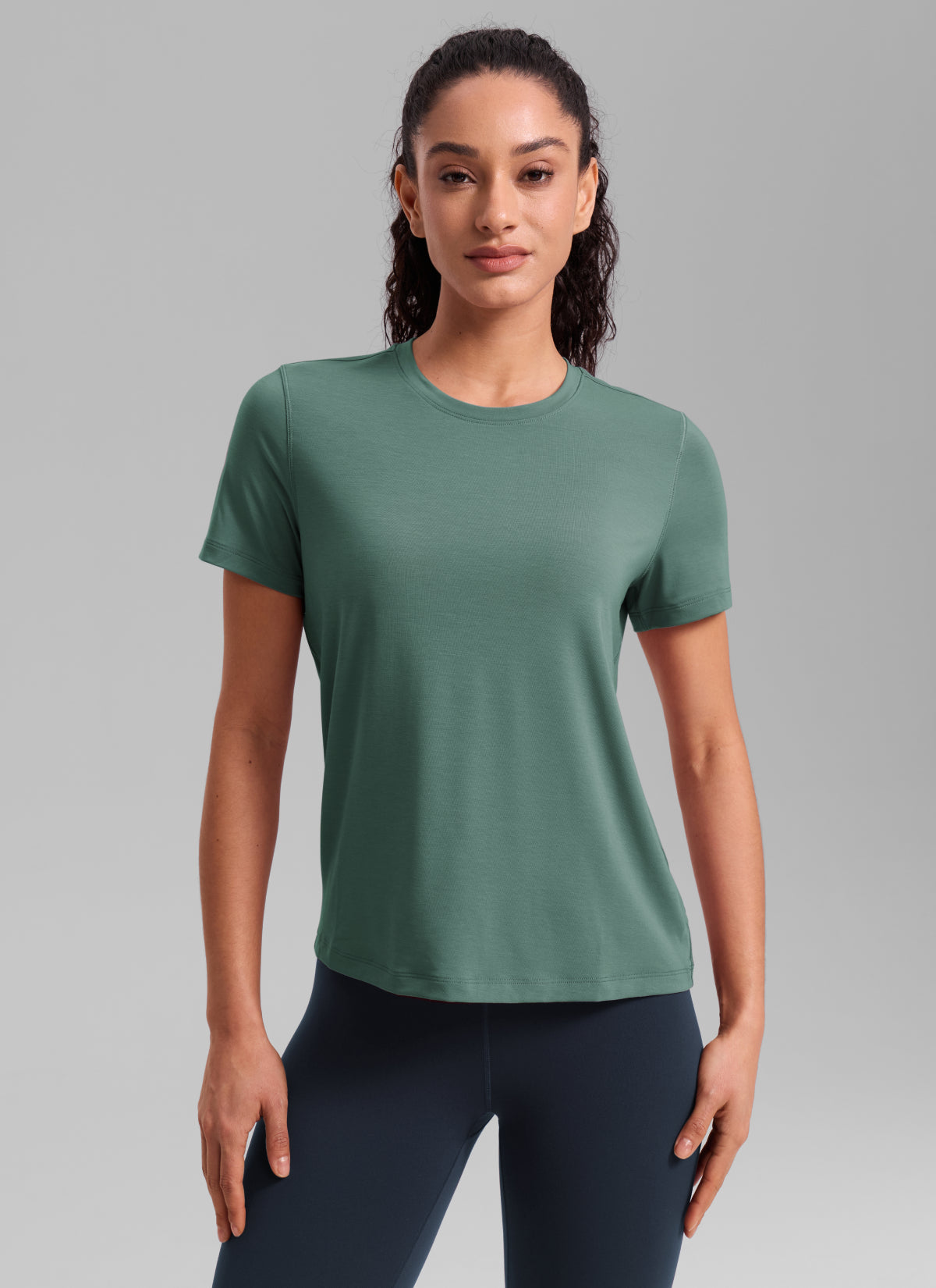 CRZ YOGA Women's Quick Dry Workout Crewneck Hip Length Short Sleeve Graphite Green @model_info:Larissa