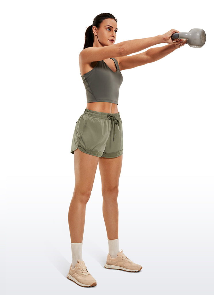 CRZ YOGA Women's Run Feathery-Fit Mid-Rise Lined Shorts Zip Pocket 3'' Light grayish blue