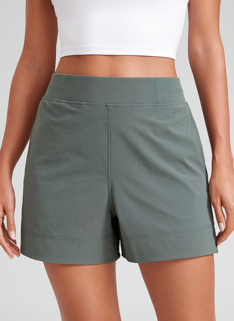 CRZ YOGA Women's Casual 4" Linerless High Waisted V Slit with Pockets Grey Sage