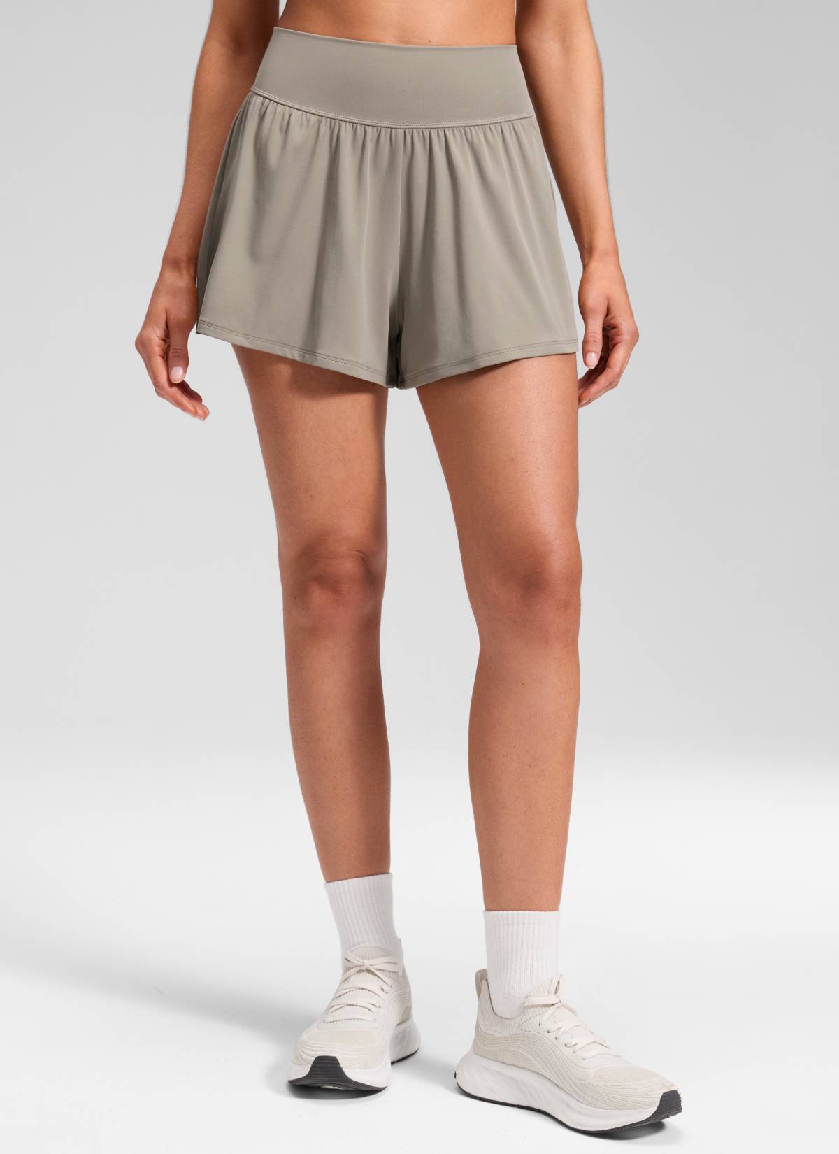 CRZ YOGA Women's Softretch Yoga High Rise Pocket Flowy 2 in 1 Shorts Warm Ash Grey @model_info:Marcela